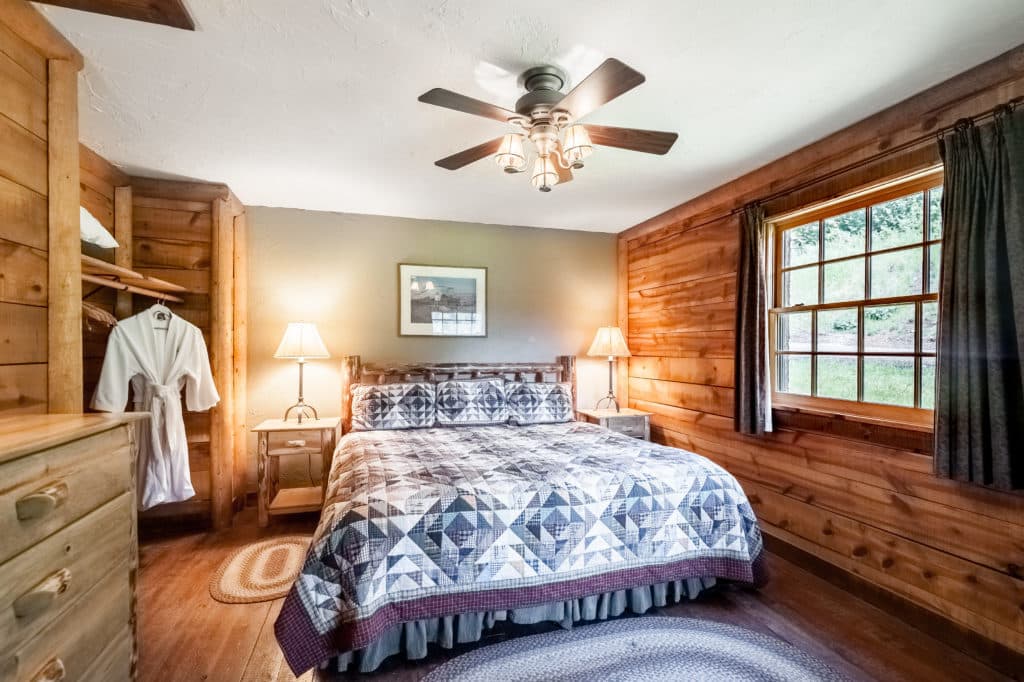 King bed, nightstands and closets in the Garnet cabin at Mountain Sky Guest Ranch