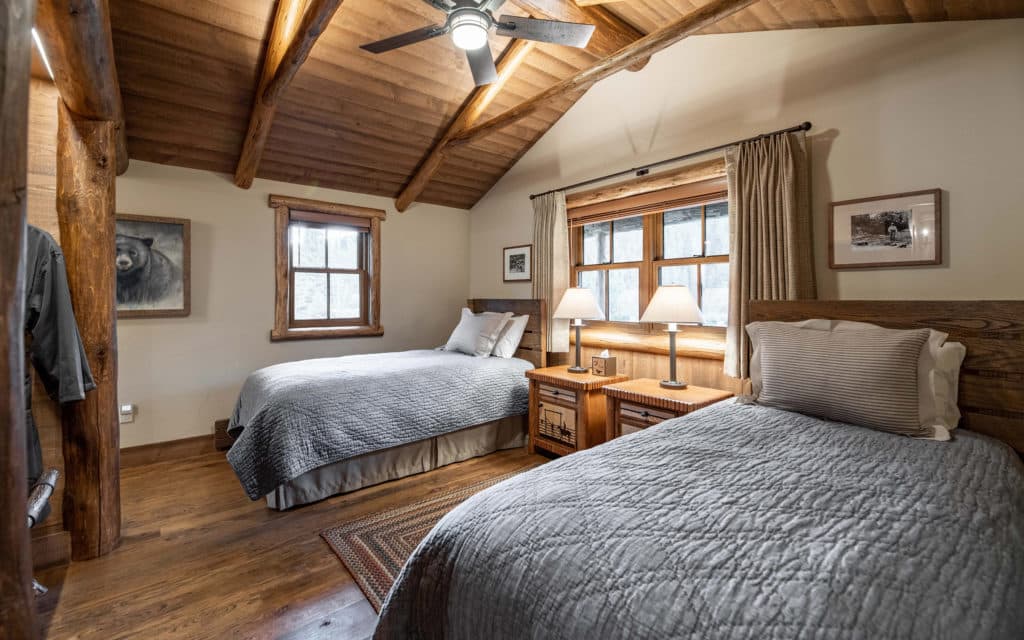 Twin beds in bedroom in the Rimini Cabin at the Mountain Sky Guest Ranch