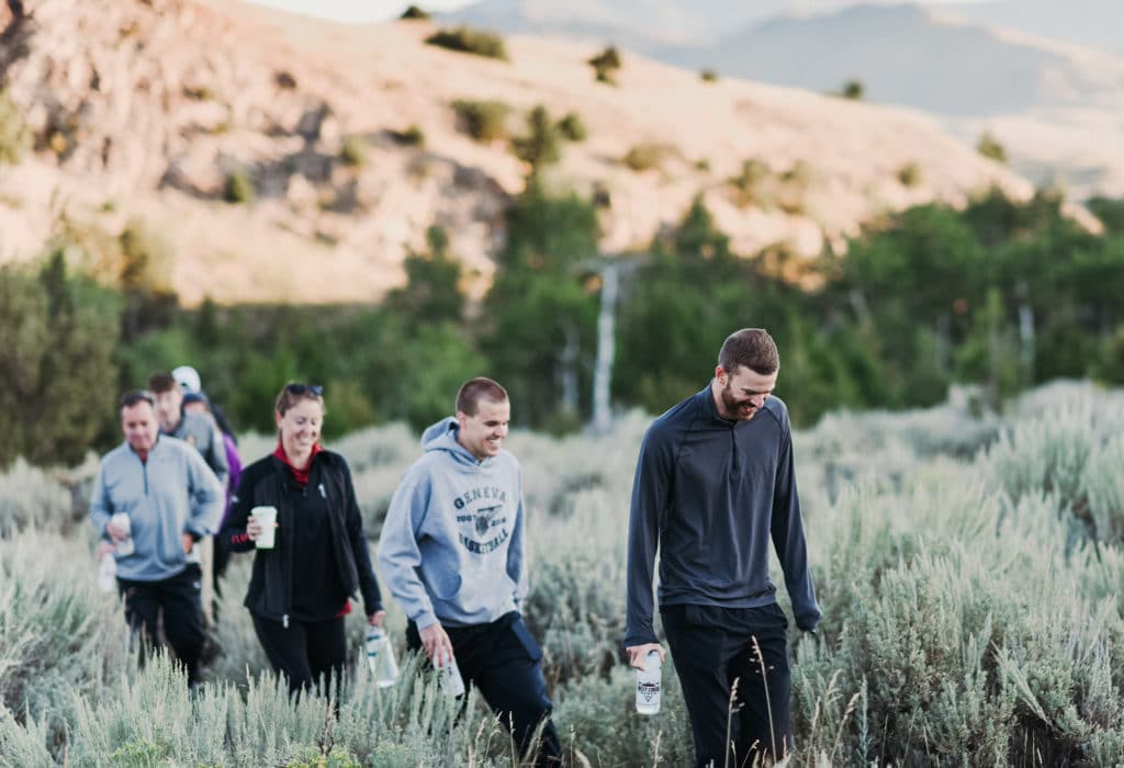 Group of smiling hikers at the Mountain Sky Guest Ranch property