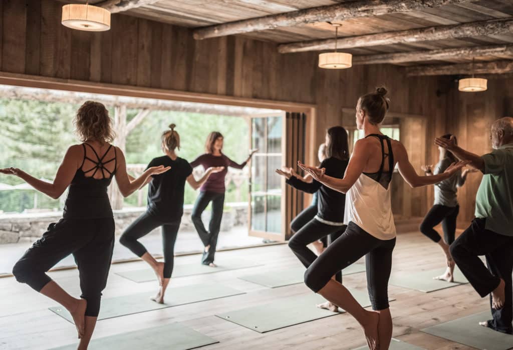 Women doing yoga in Mountain Sky Guest Ranch's yoga center