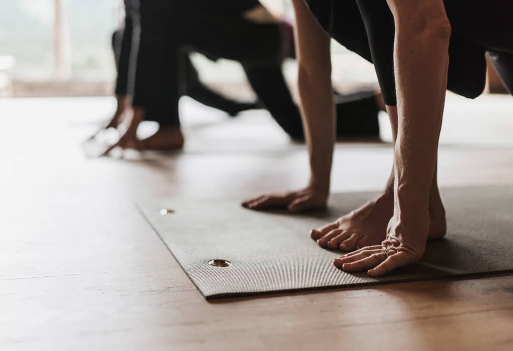 Mountain Sky guests on yoga mats in the Ranch's yoga center