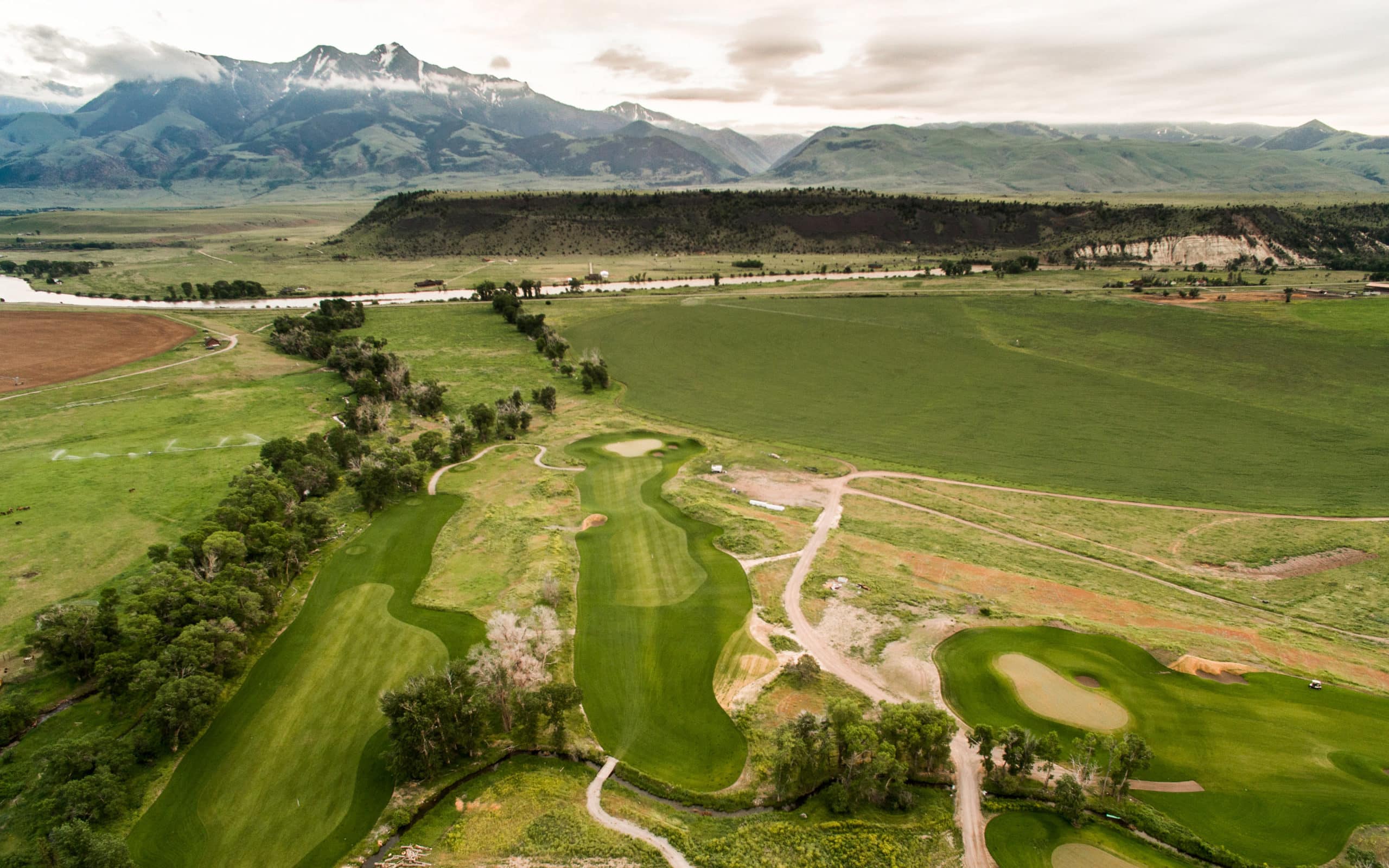 Rising Sun Golf Course Aerial Mountain Sky Guest Ranch